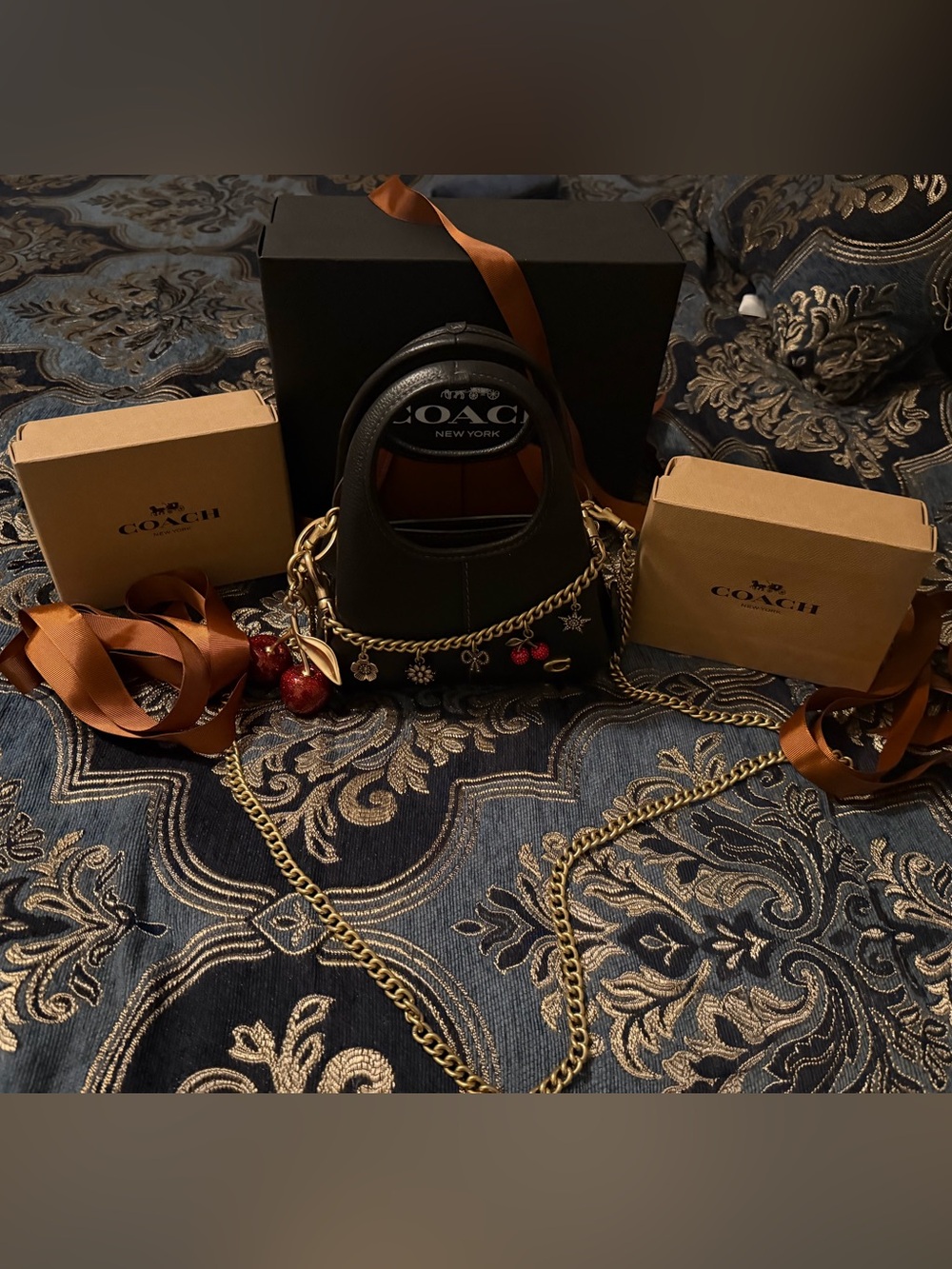 Coach Black Mini Tote with Gold Chain and Red Charm Accents
